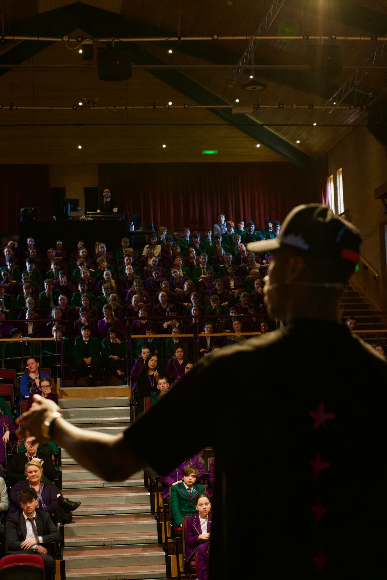 Kofi Josephs speaking to an auditorium of students
